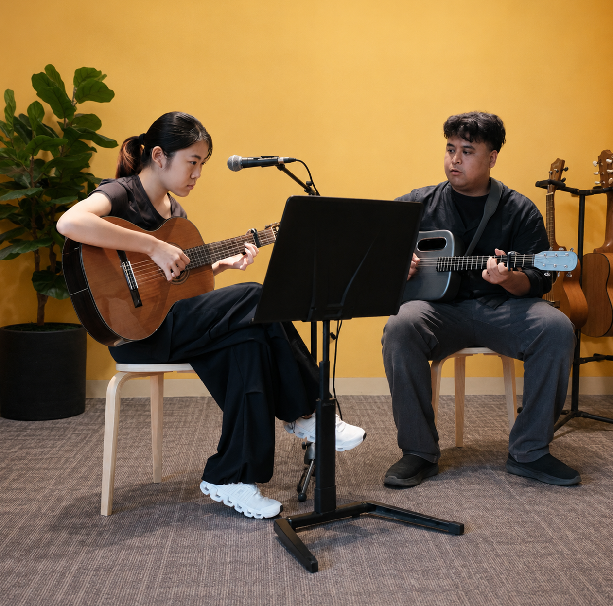 Guitar student learning at Dandelion School of Music