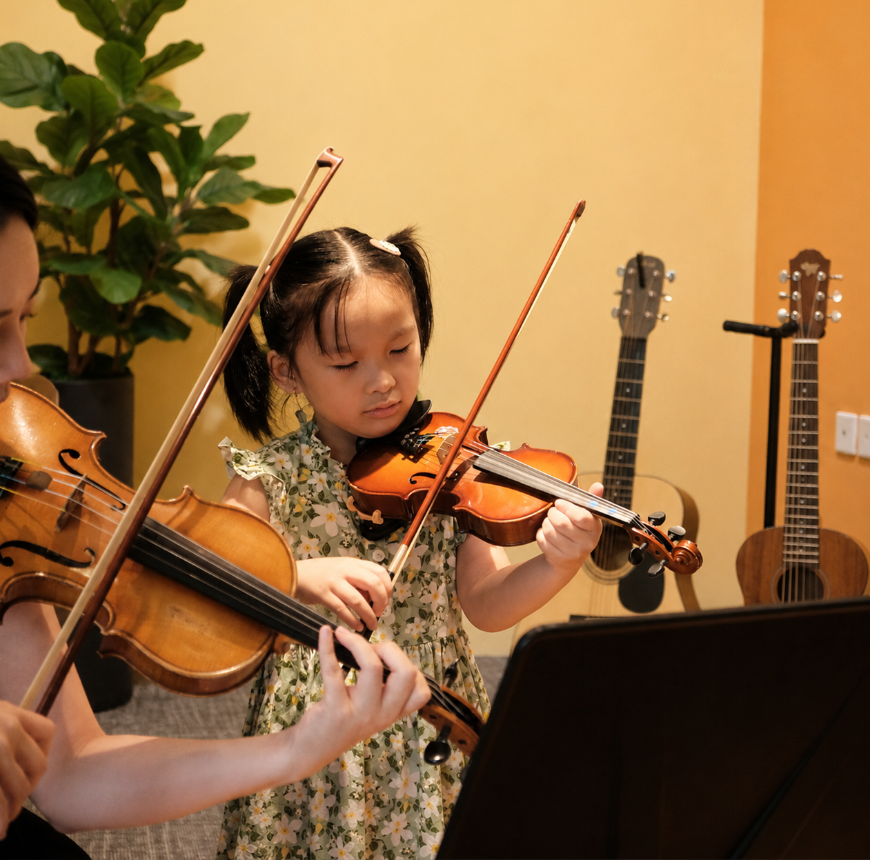Violin student learning at Dandelion School of Music